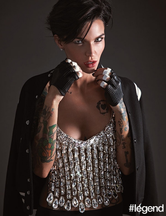 Jacket by Saint Laurent, top by Jean Paul Gaultier, gloves by Majesty Black, earrings by Le Vian